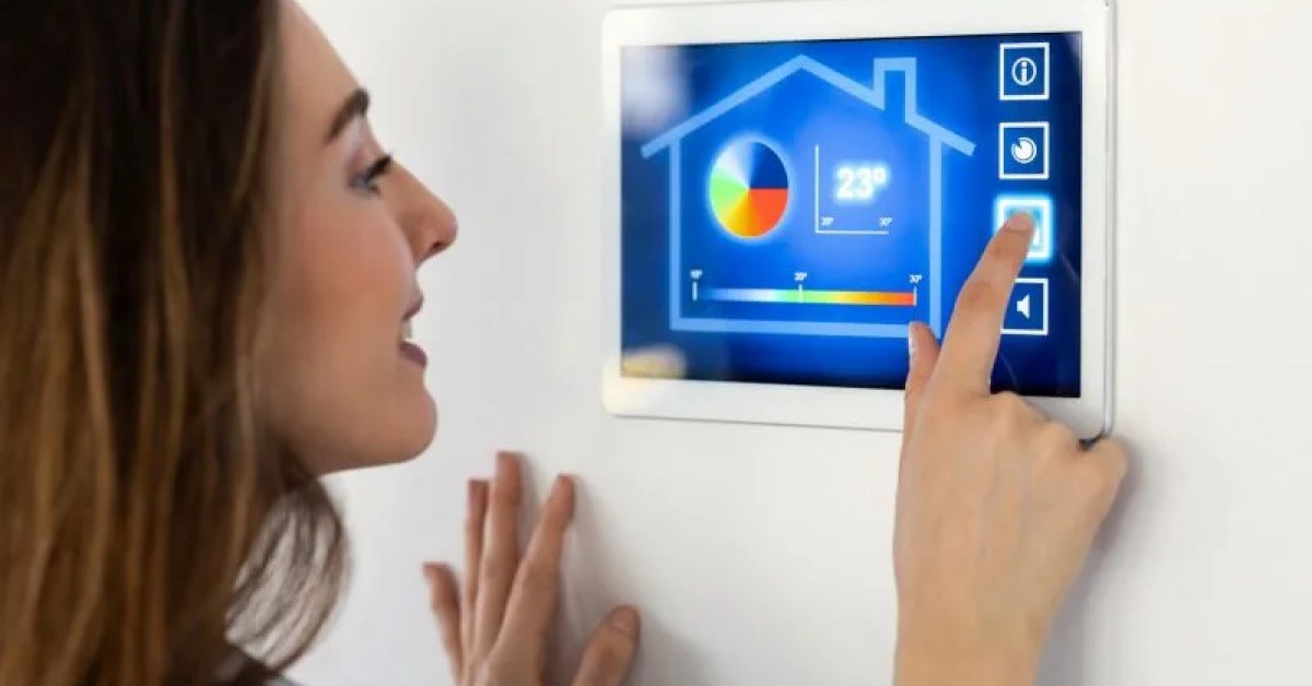 Smart home controls on a tablet beside a wall switch